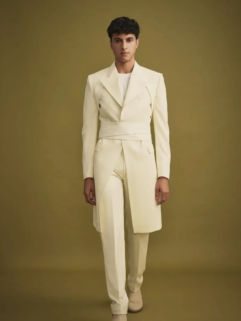 Ivory belted long jacket, cut at RAJASAB