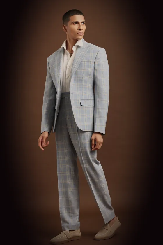 The grey windowpane check jacket, single-breasted, worn with its trousers