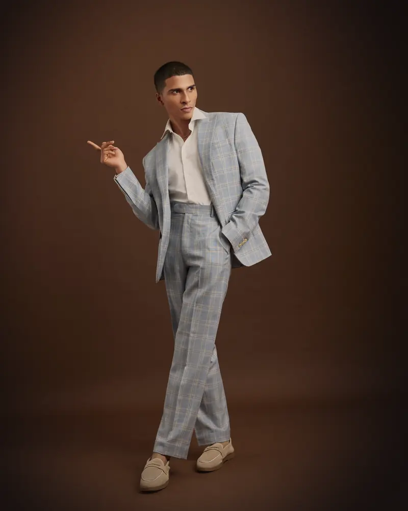 Worn: The same jacket, open · with its trousers, in the same check.