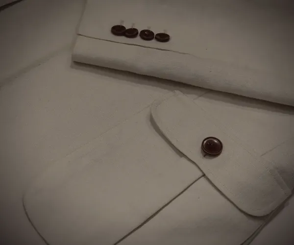 Captain Jodhpuri: Four buttons at the cuff · flap pocket at the hip.