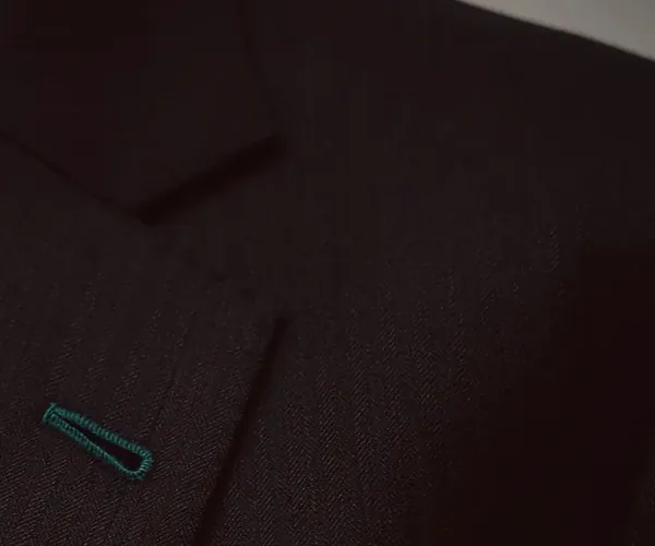 Classic Suit: Notch lapel with a buttonhole · in navy.