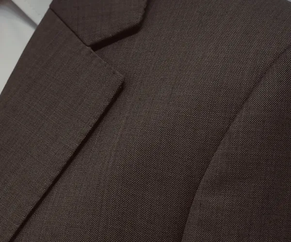 Havana Suit: Notch lapel and chest pocket · in brown check.