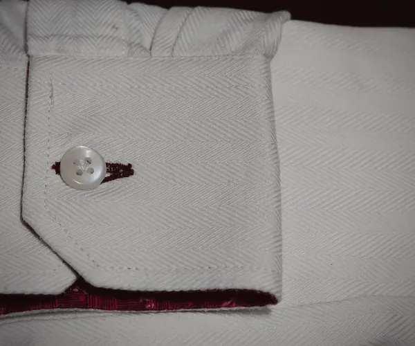 Kensington Shirt: Cut-corner cuff, one button · printed facing.