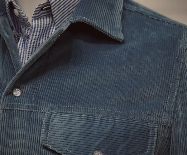 Montana Jacket: Point collar and flap pocket · in blue corduroy.