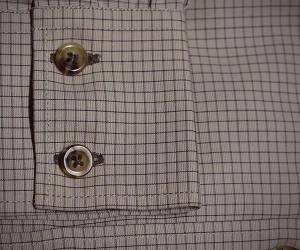 Oxford Shirt: Two-button cut-corner cuff.