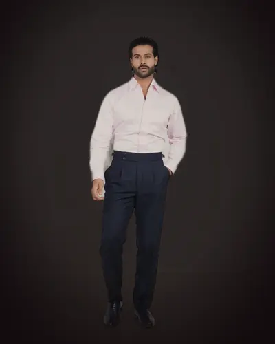 The pleated trousers, worn with a shirt