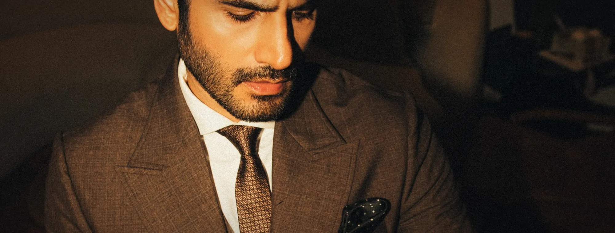 Karan Tacker · brown three-piece