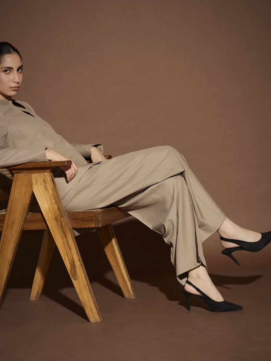 Seated, jacket buttoned