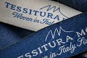 Tessitura Monti woven label on its cloth