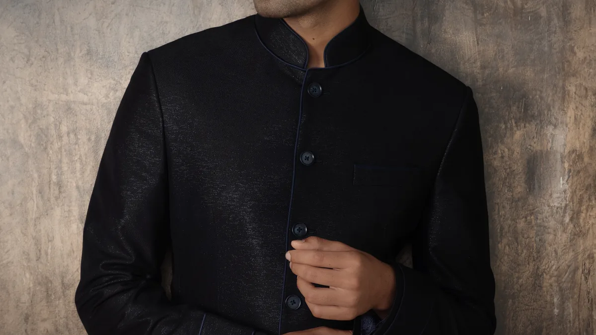 Black bandhgala · plaster wall
